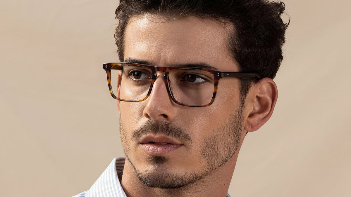 Bearded man wearing brown tortoise rectangular eyeglasses