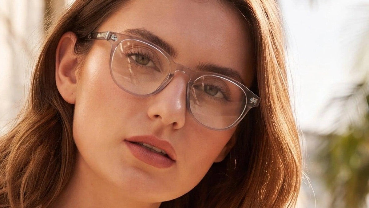 Woman wearing clear grey prescription glasses outdoors