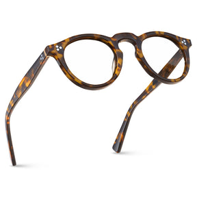 Premium tortoiseshell acetate eyeglasses detail closeup showing natural amber brown pattern Italian craftsmanship and quality finish fly
